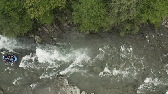 Group of people rafting in a river in Tuscany, Italy