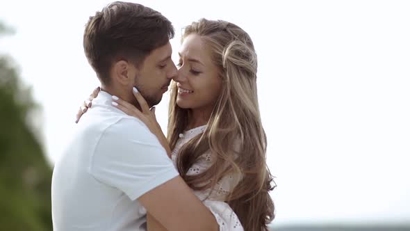 Romantic Couple. Man And Woman Kissing In Nature.