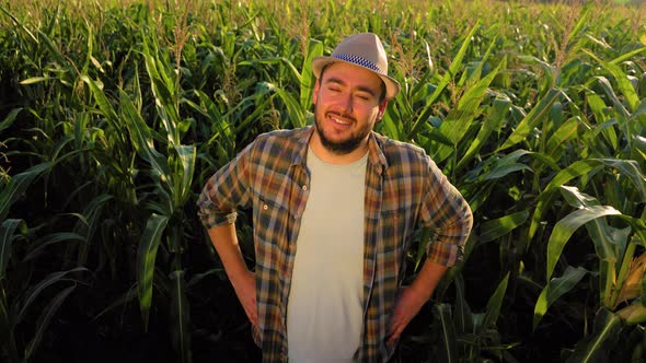 Top View Against Background Cornfield Young Man Agronomist Stand Joyfully Put Hands on Hips