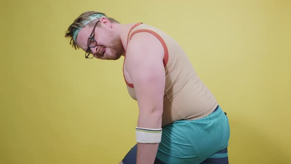 an Overweight Man Plays Sports on a Yellow Background