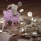 Falling Euro Coins on the Money Box Pig and Wood Floor - VideoHive Item for Sale