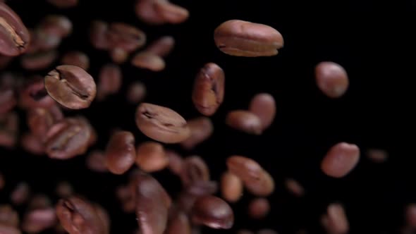 Freshly Roasted Coffee Beans Fly Down and Spin