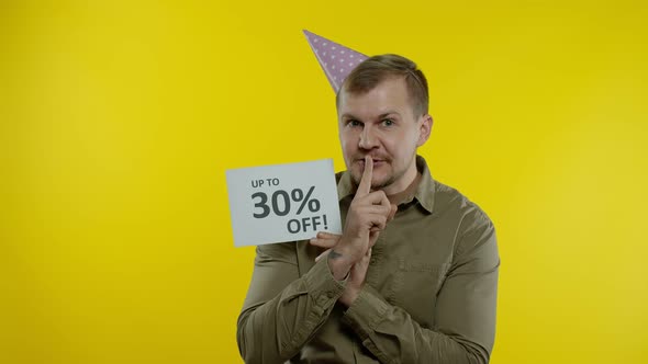 Joyful Man Showing Sale Word and Showing Up To 30 Percent Off Inscription. Black Friday Concept