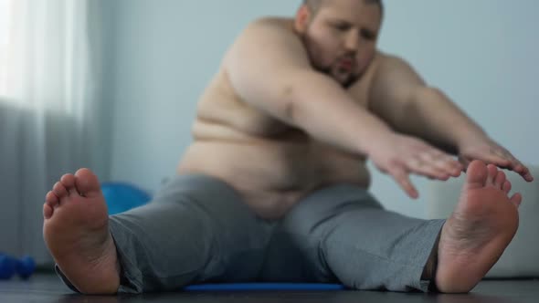 Stretching Fat Man Reaching Toes, Weight Loss Decision, Health and Motivation