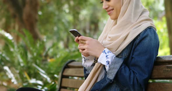 Woman in Hijab Using Mobile Phone 4k