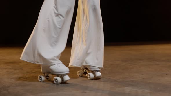 Female Legs in Vintage Roller Skates Skating Around on the Stage