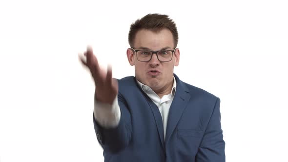 Angry Businessman in Blue Suit and Glasses Yelling at Someone and Scolding Shaking Hands and