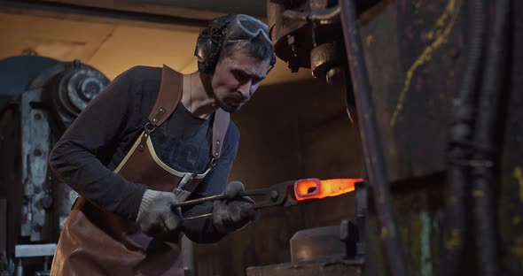 Blacksmith Forges Ax Mechanical Press