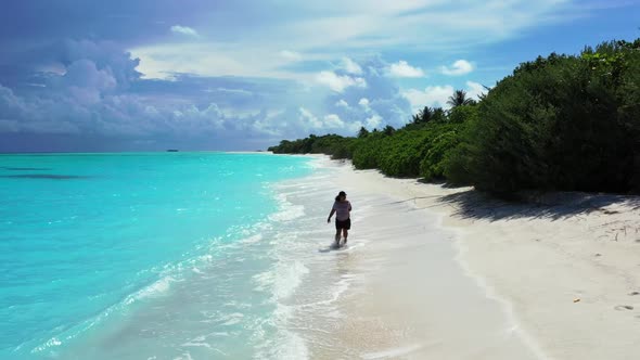 Girl loves life on luxury seashore beach vacation by blue lagoon with white sandy background of the 