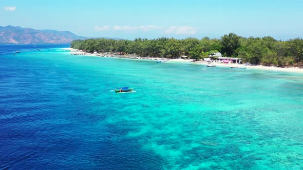 Aerial above panorama of perfect coast beach break by aqua blue lagoon and white sandy background of