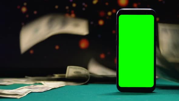 Lot of Cash Lying Near Smartphone With Green Screen, Online Winnings, Casino App