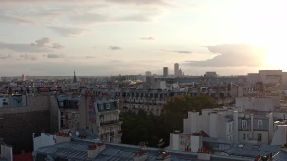 Rising drone shot of Eastern Paris at sunset