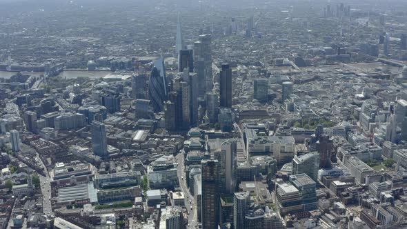 High dolly forward drone shot over central London skyscrapers