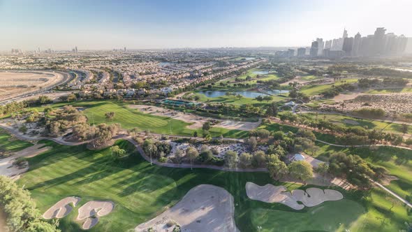 Golf Course and Jumeirah Lake Towers Skyscrapers Before Sunset Timelapse Dubai United Arab Emirates