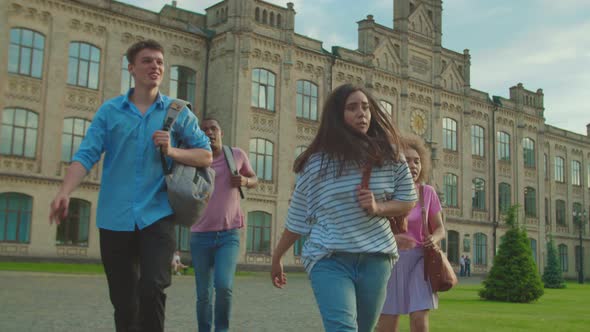 Mixed Race Students Walking Fast Because of Late to Classes Outdoors