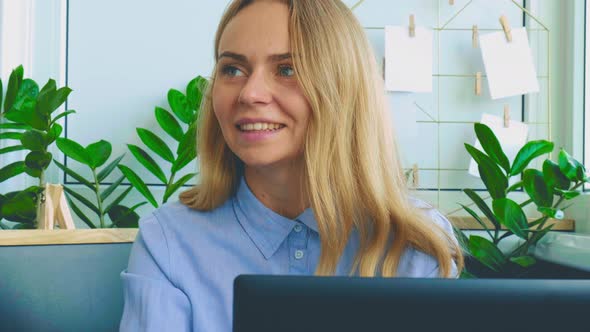 Young Woman Working on a Computer at Office