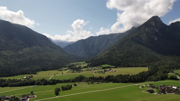 Aerial view of the village, fields and forest in mountains Alps Austria