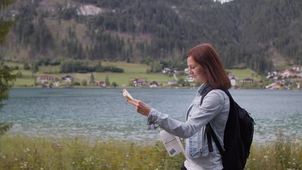 Hiker Using a Paper Map in Austria