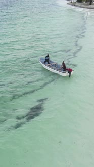 Boat Boats in the Ocean Near the Coast of Zanzibar Tanzania Slow Motion Vertical Video