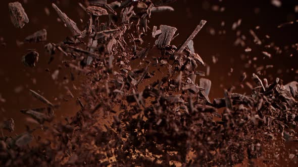 Super Slow Motion Shot of Raw Chocolate Pieces and Cocoa Powder After Being Exploded at 1000Fps
