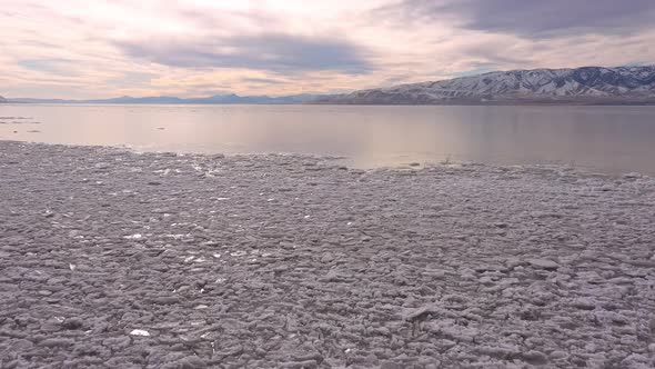 Flying over broken ice on Utah Lake during winter