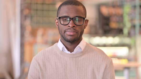 Portrait of Serious African Man Looking at Camera 