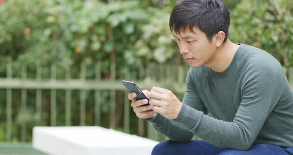 Man use of mobile phone at outdoor