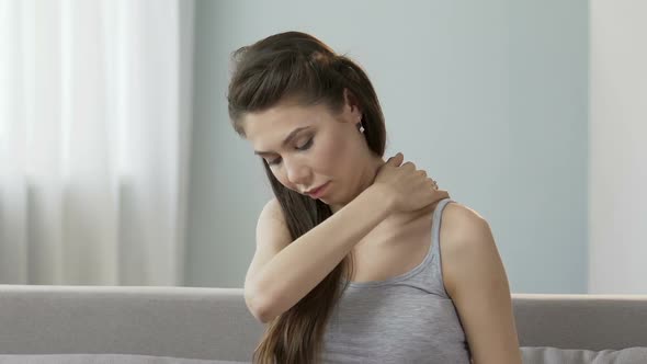 Young Female Massaging Neck and Shoulders, Releasing Disturbing Pain, Stiff Neck