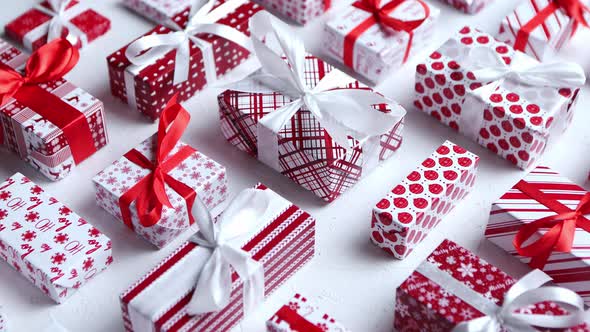 Various Pattern and Size Christmas Boxes Placed on White Background. Wrapped in Festive Paper