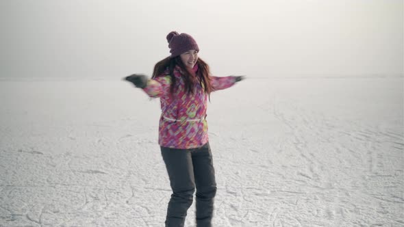 4K Girl ice skating on frozen lake