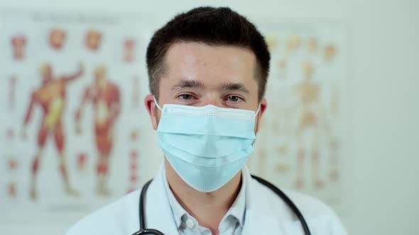 Close Up Portrait of Family Medical Doctor is in Health Clinic