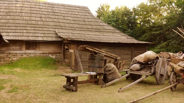 Peasant Yard with Carts and Bags