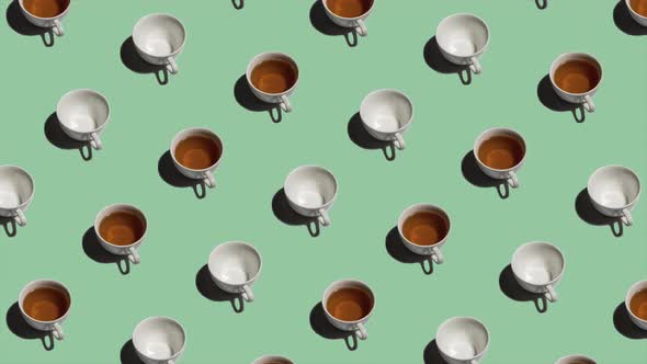 Pattern with Many Tea Cups and Empty Cups Animated on Light Green Background