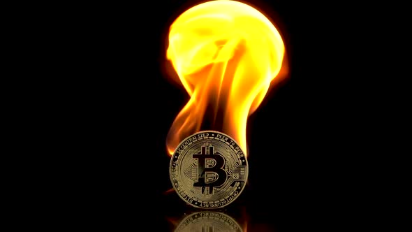 Bitcoin Coin Catches Fire on an Isolated Black Background