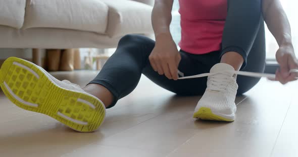 Woman wear sport shoes and prepare for running