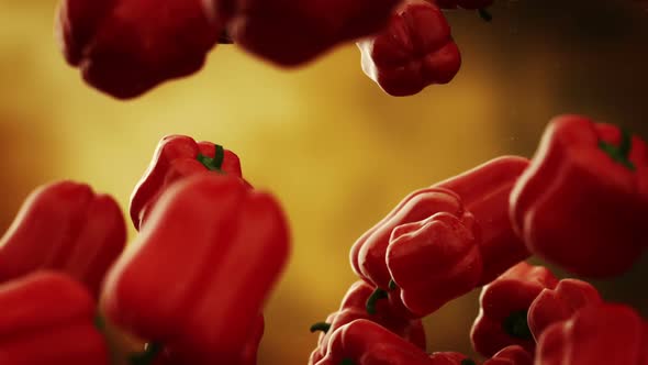 Slow motion animation of natural red bell peppers falling down. Loopable. HD