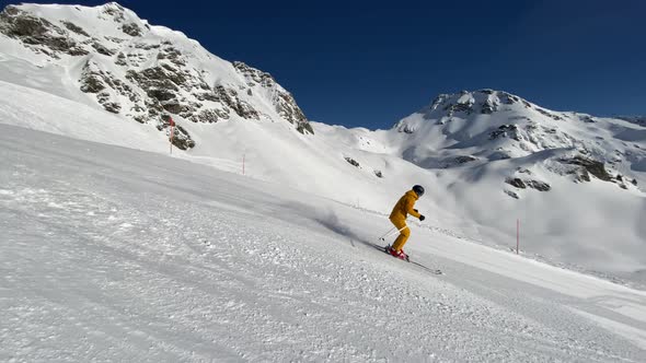 Slow Motion Video Sporty Man Skiing in Short Turns