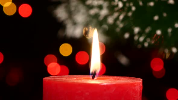 Two Red Candles with Christmas Decorations on Black, Bokeh, Light, Garland, Cam Moves To the Right