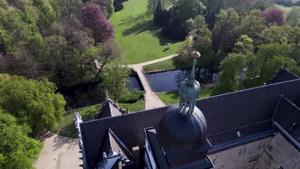 rotating around Wolfsburg clock tower of castle surrounded by gardens