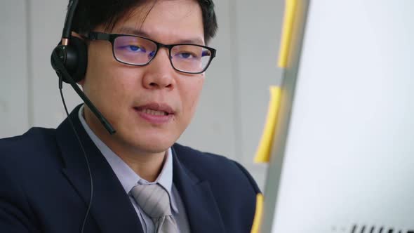 Business People Wearing Headset Working in Office