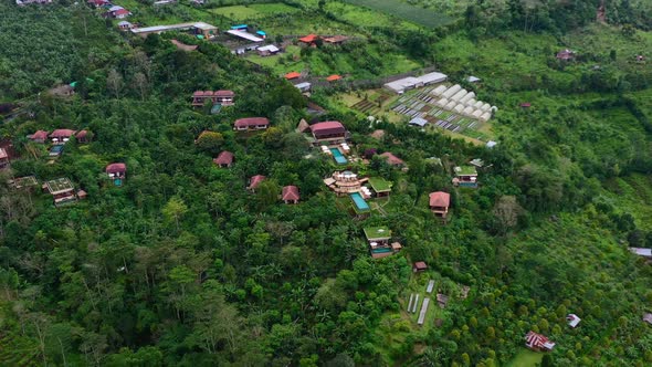 dolly out of mountain luxury resort atop a green mountain hill in Munduk Bali Indonesia