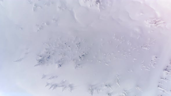 Pristine Untouched Powder Snow Field Overhead Aerial Background Floating Slow alt