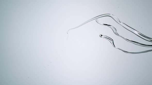 Water splashes in midair on white background, Slow Motion alt