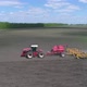 A Farmer on a Tractor Sows and Plows the Soil at the Same Time - VideoHive Item for Sale