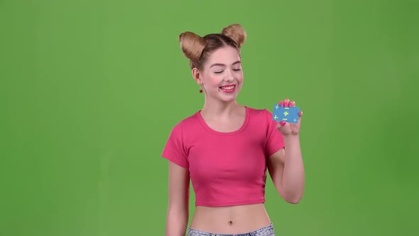 Teenager Advertises a Card and Shows a Thumbs Up. Green Screen