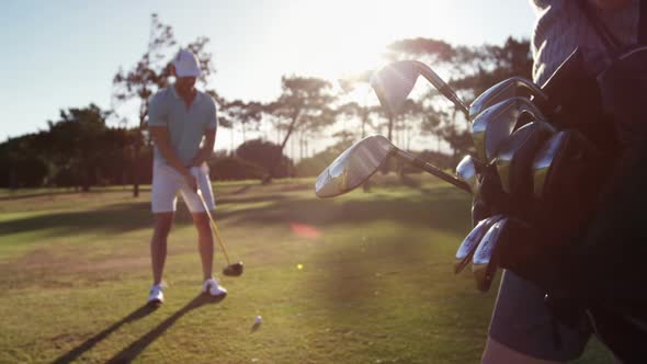 Golfer playing golf