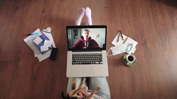 Young Woman Smiling While Videoconferencing at Home During Coronavirus Self Quarantine