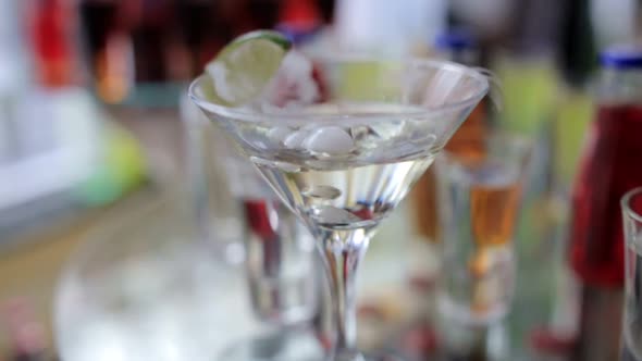 Smoking Martini Cocktail in a Conical Glass with Wafting Vapor