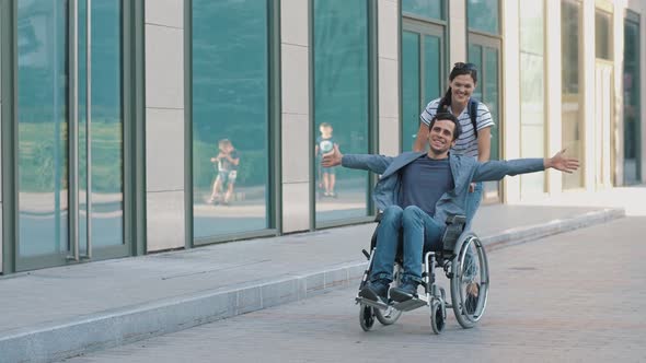 Happy Man in Wheelchair with Wife