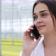 Researcher Talks on the Phone Standing in Greenhouse - VideoHive Item for Sale